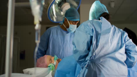 Patient-Lying-on-Operating-Theatre-With-Surgeons