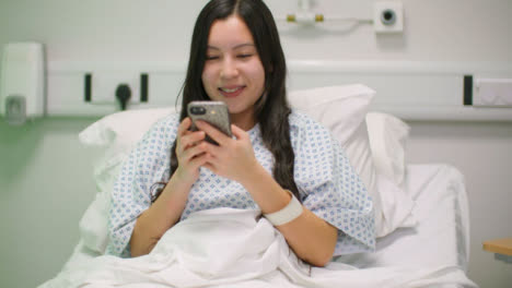 Pan-Female-Hospital-Patient-Using-Phone