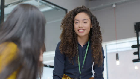 Businesswoman-Presenting-To-Group-Of-Colleagues-