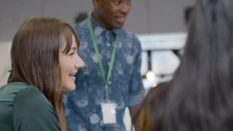 Woman-Smiles-And-Laughs-During-Meeting-