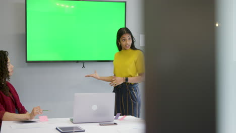 Woman-Leading-Meeting-With-Colleagues-Using-Green-Screen