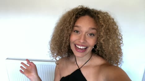 Mixed-Race-African-American-Woman-Giving-Good-News-Over-Video