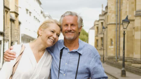 Tracking-Close-Up-of--Middle-Aged-Tourist-Couple-Exploring-City