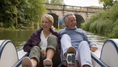 Medium-Shot-of-Middle-Aged-Tourist-Couple-Enjoying-Pedal-Boat