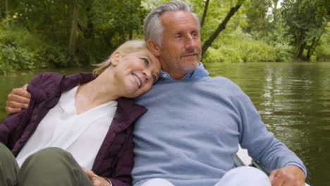 Close-Up-of-Middle-Aged-Couple-Enjoying-Scenery-From-Pedal-Boat