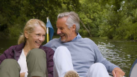 Medium-Shot-of-Middle-Aged-Tourist-Couple-Enjoying-Pedal-Boat-Ride