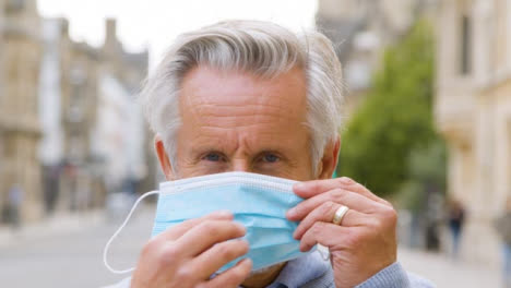 Close-Up-of-Middle-Aged-Man-Wearing-a-Face-Mask-In-City