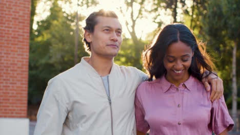 Tracking-Shot-of-Couple-Laughing-and-Walking-Together