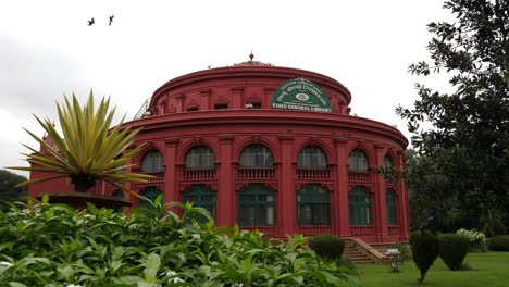 Bengaluru-Karnataka--India--September-1-2019-Wide-angle-view-of-the-Central-library-located-inside-the-Cubbon-park-with-the-plants-and-trees-in-the-foreground