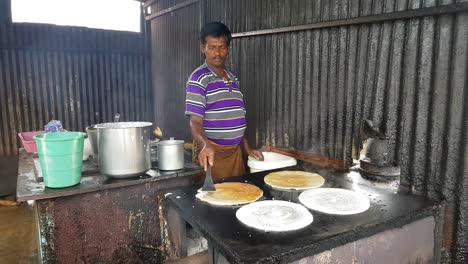 Chennai-Tamilnadu--India--July-29-2019-A-man-making-dosa-(Indian-Pancake)-in-a-road-side-shop