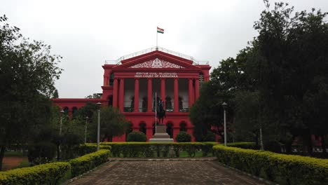 Bengaluru,-Karnataka-/-India---September-1-2019:-Wide-angle-view-of-the-Karnataka-state-high-court-on-a-cloudy-day-with-the-Indian-flag-hoisted-on-top