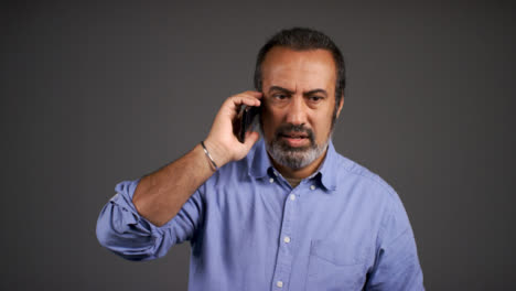Middle-Aged-Man-Receives-Bad-News-Over-Phone