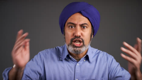 Angry-Middle-Aged-Man-In-Turban-Shouting-Portrait