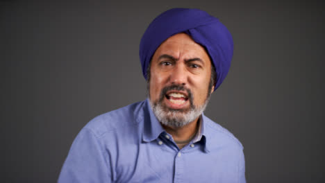 Frustrated-Middle-Aged-Man-In-Turban-Shouting-Portrait
