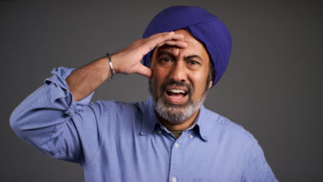 Confused-and-Frustrated-Middle-Aged-Man-In-Turban-Portrait