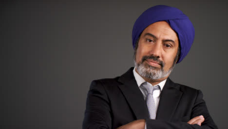 Middle-Aged-Businessman-In-Turban-Folding-Arms-and-Looking-Confident