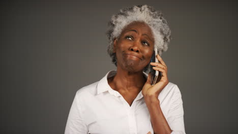 Smartly-Dressed-Woman-Receiving-Bad-News-On-Phone