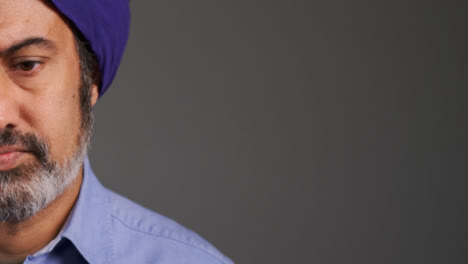 Middle-Aged-Man-In-Turban-Visibly-Concerned-with-Copy-Space
