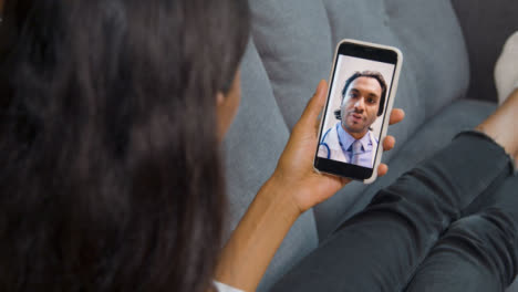 Young-Woman-Having-Video-Call-with-Doctor