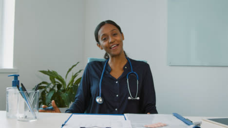 Young-Female-Doctor-Leading-Video-Meeting-Briefing