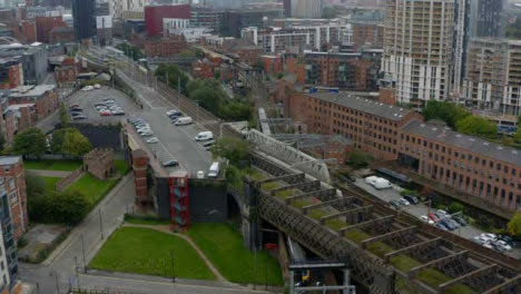 Drone-Shot-Tracking-Train-Travelling-Through-Castlefield-Canals-07