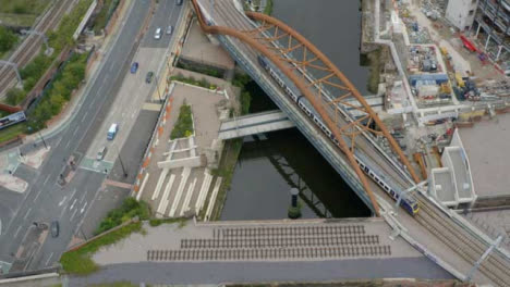 Overhead-Drone-Shot-Tracking-Train-Travelling-Through-Castlefield-Canals-02