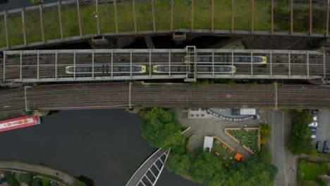 Overhead-Drone-Shot-Tracking-Train-Travelling-Through-Castlefield-Canals-04