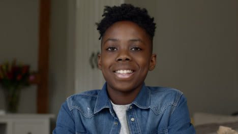 Young-Boy-Smiling-and-Talking-into-Webcam-During-Video-Call