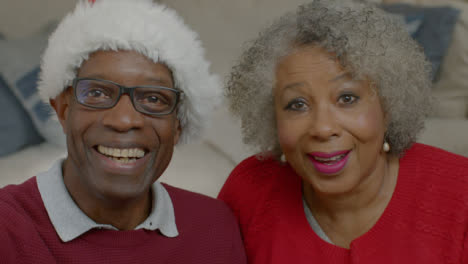 Older-Couple-Listening-Intently-During-Christmas-Video-Call
