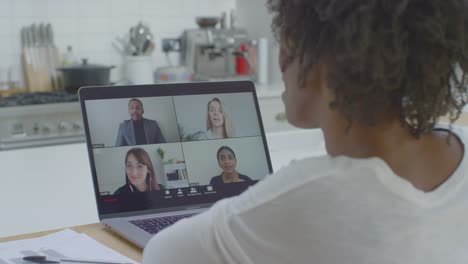 Middle-Aged-Woman-Talking-to-Other-People-On-Laptop-Video-Conference