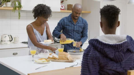 Young-Boy-Joins-His-Family-at-Kitchen-Island-During-Breakfast-02