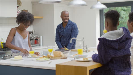 Family-Enjoying-Breakfast-Together-at-a-Kitchen-Island-