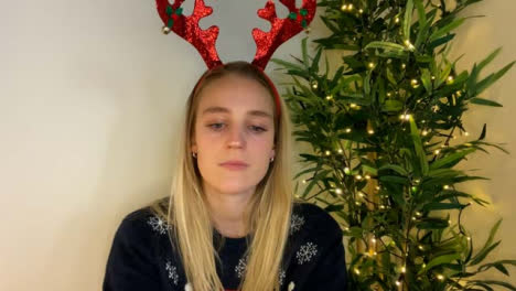 Young-Woman-On-Christmas-Video-Call-Looking-Visibly-Depressed-and-Talking-to-Camera