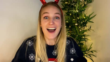Young-Woman-On-Christmas-Video-Call-Attempting-to-Guess-Word-During-Charades-Game