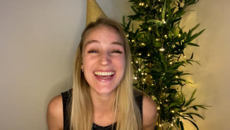 Young-Woman-On-Video-Call-Counting-Down-to-Midnight-and-Celebrating-Turn-of-New-Year