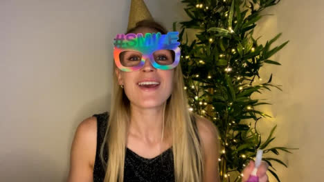 Young-Woman-On-Video-Call-Countdown-to-Midnight-and-Celebrating-New-Year