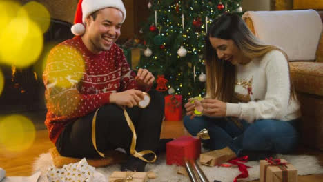 Wide-Shot-of-a-Young-Couple-Wrapping-a-Christmas-Present-Together-