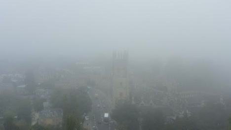 Drone-Shot-Pulling-Away-From-Buildings-In-Misty-Oxford-01
