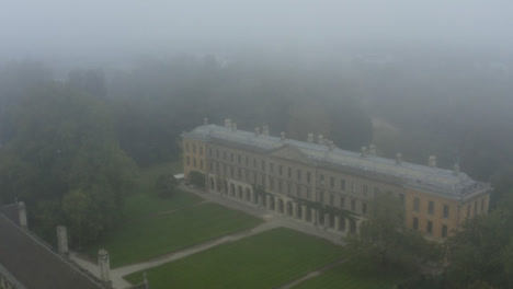 Drone-Shot-Approaching-Buildings-In-Misty-Oxford-01