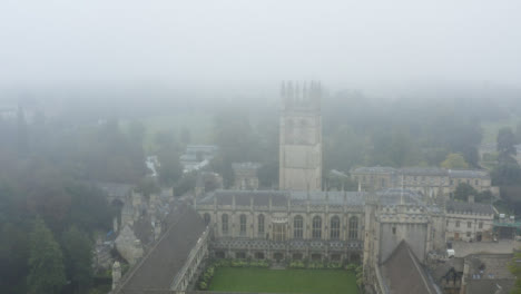 Drone-Shot-Pulling-Away-From-Buildings-In-Misty-Oxford-04
