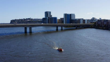 Drone-Shot-Tracking-Speedboat-On-River-Severn