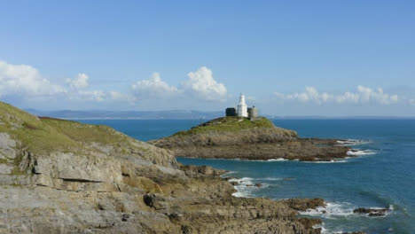 Drone-Shot-Orbiting-Mumbles-Lighthouse-In-Swansea-Short-Version-1-of-2