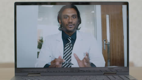 Sliding-Medium-Shot-of-Laptop-Screen-with-Doctor-On-Video-Call