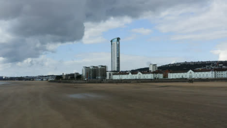 Drone-Shot-Passing-Over-Sand-of-Swansea-Beach-03