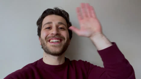 Young-University-Student-Waving-Talking-and-Waving-Directly-to-Camera