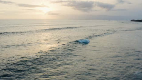 Drone-Shot-Pulling-Away-from-Group-of-Surfers-Out-at-Sea