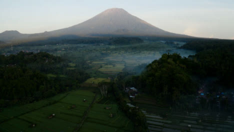 Drone-Shot-Pulling-Away-and-Tilting-Up-Revealing-Mount-Agung-Volcano