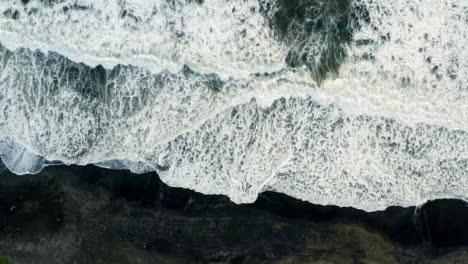 Drone-Shot-Ascending-Above-Waves-at-Pigstone-Beach