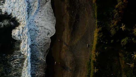 Drone-Shot-Descending-On-Waves-at-Black-Sand-Pigstone-Beach
