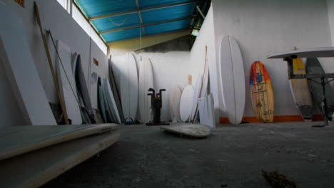 Handheld-Sliding-Low-Angle-Shot-of-Surfboard-Workshop